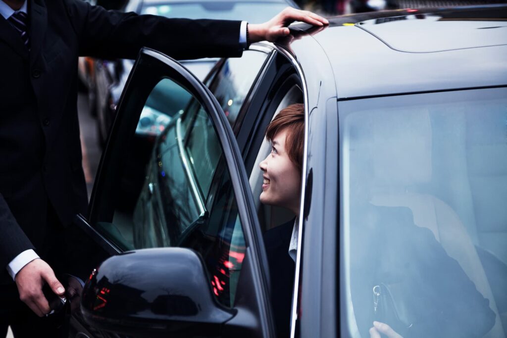 Businessman Opening Car Door For Businesswoman Dur 2024 10 23 08 32 05 Utc 1 1024x683